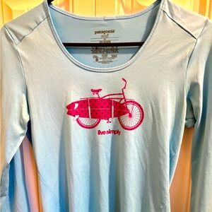 Patagonia Capilene Long Sleeve Top in Blue with Surf/Bike graphic: XS